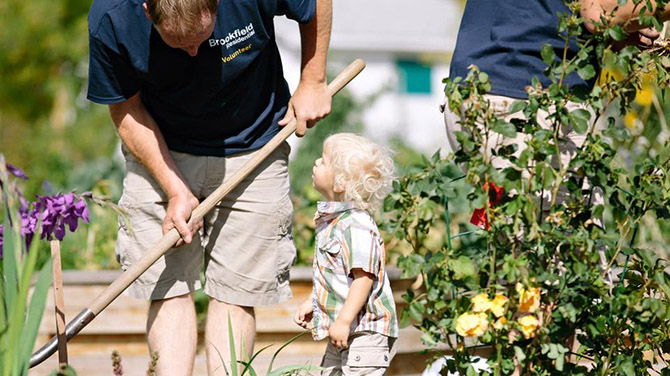 Man and child gardening Brookfield Residential