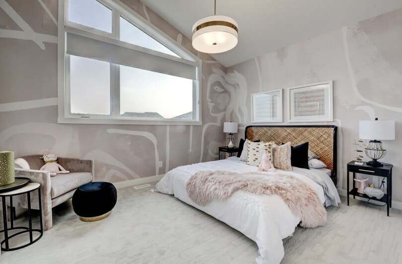 Mural of a woman on the walls in a bedroom of the Lucca plan in Cranstons Riverstone in Calgary, AB