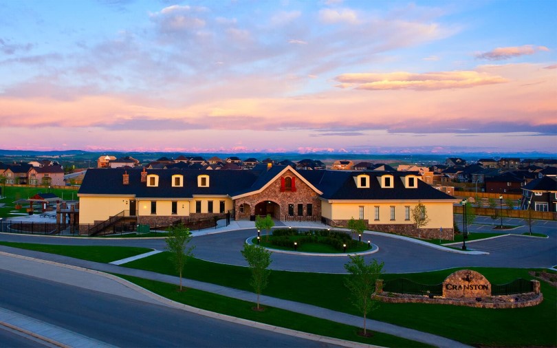 Exterior of Century Hall at sunset at Cranstons Riverstone in Calgary, AB