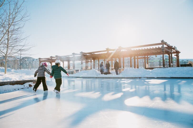 Kids skating on ice at Chappelle Gardens in Edmonton by Brookfield Residential