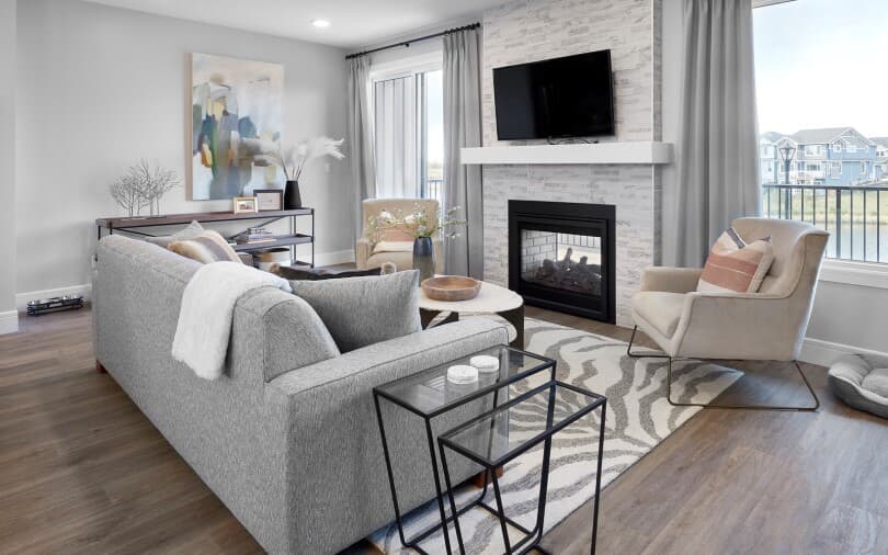 Living room with fireplace in Hudson in Edmonton, AB by Brookfield Residential