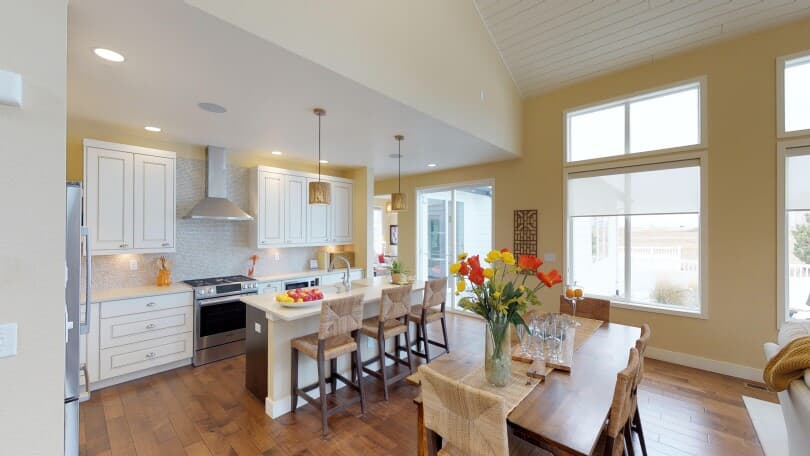 Interior view of the dining area and kitchen in the Freestyle 6 floor plan at Brighton Crossings, Colorado