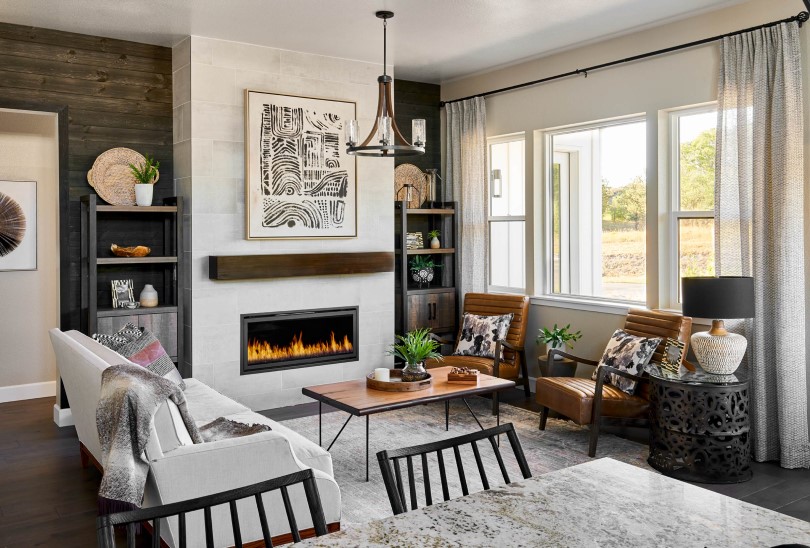 Living room with fireplace and cozy seating at The Village at Castle Pines in Denver, CO
