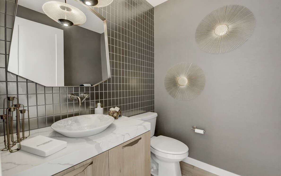 Powder room in the Lucca show home at Cranstons Riverstone by Brookfield Residential in Calgary AB