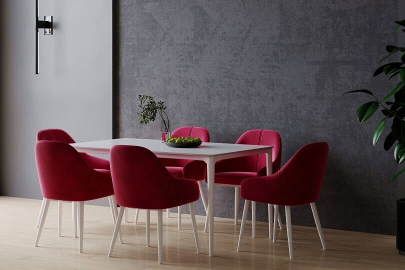 Magenta dining chairs in a dark tone dining room