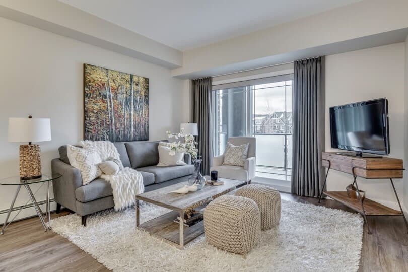 Cozy great room in the Nelson condo at Regatta in Auburn Bay, Calgary by Brookfield Residential