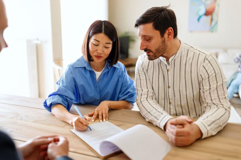 Couple signing a contract