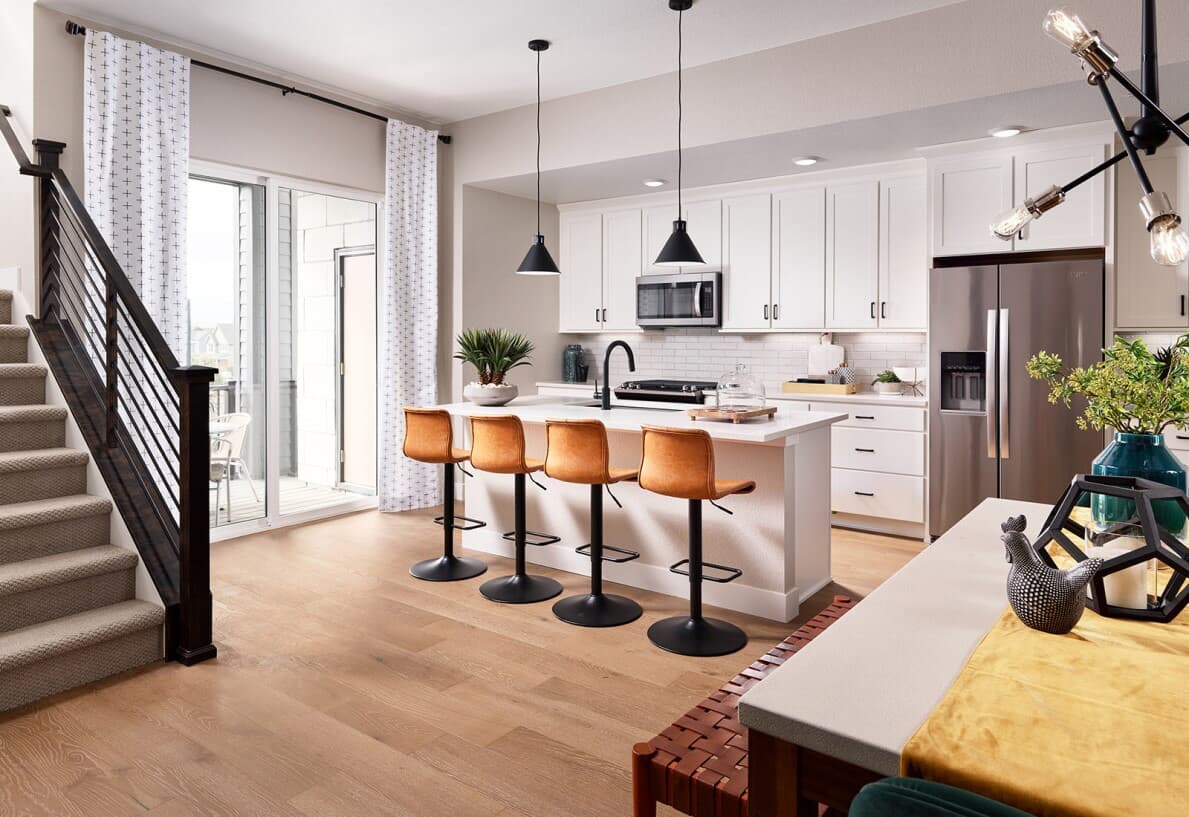 White kitchen in Cadence Townhomes at Midtown by Brookfield Residential in Denver CO