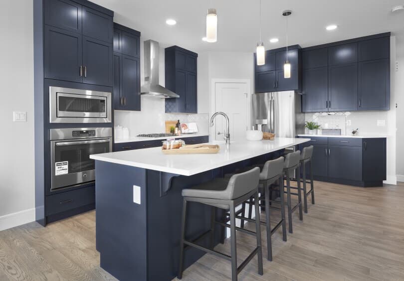 Navy blue kitchen in Robson 12 at The Orchards by Brookfield Residential in Edmonton AB