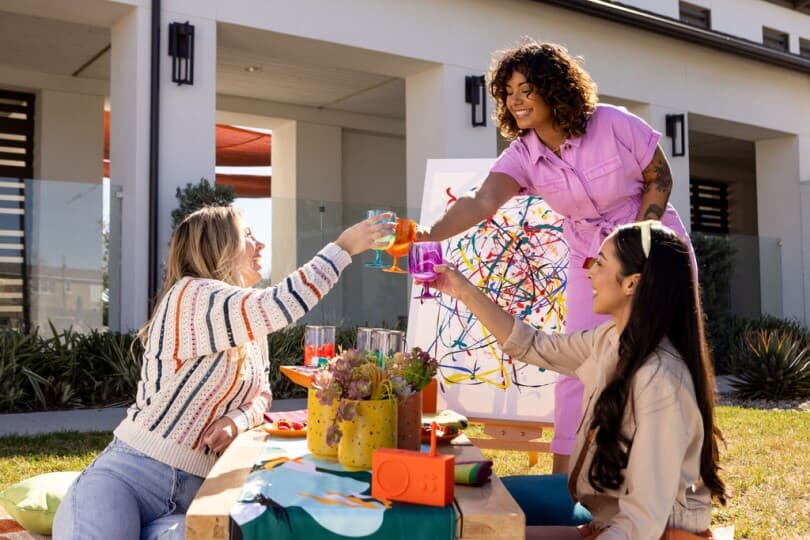 Friends having a paint party at New Haven by Brookfield Residential in Ontario CA