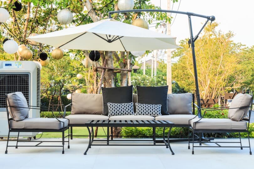 Outdoor living area in a backyard with an offset umbrella