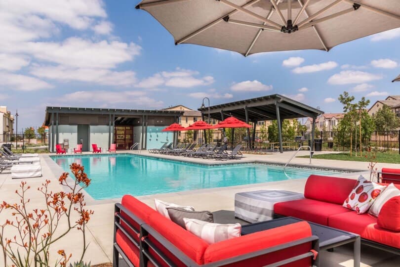 Outdoor seating and pool at Cherry Park at New Haven by Brookfield Residential in Ontario Ranch CA