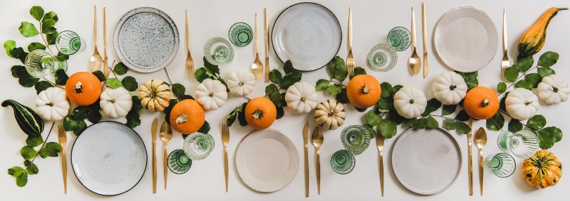 Fall inspired tablescape with greenery and pumpkins