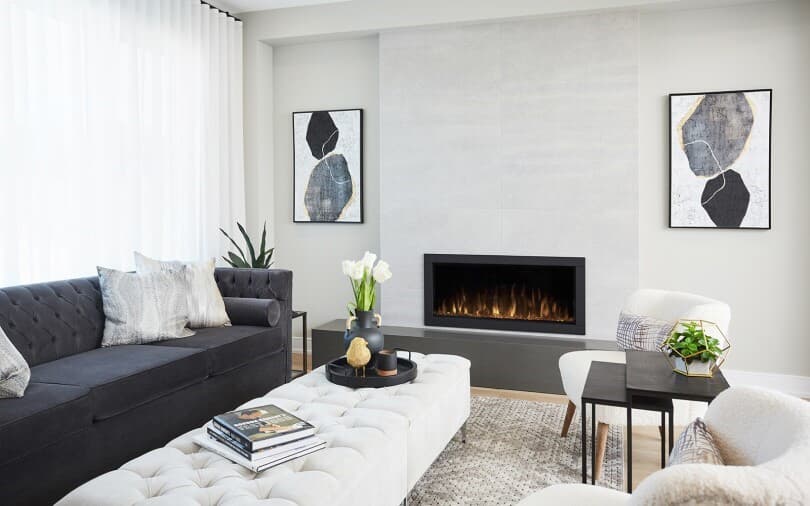 Cozy living room with fireplace at Midhurst Valley by Brookfield Residential