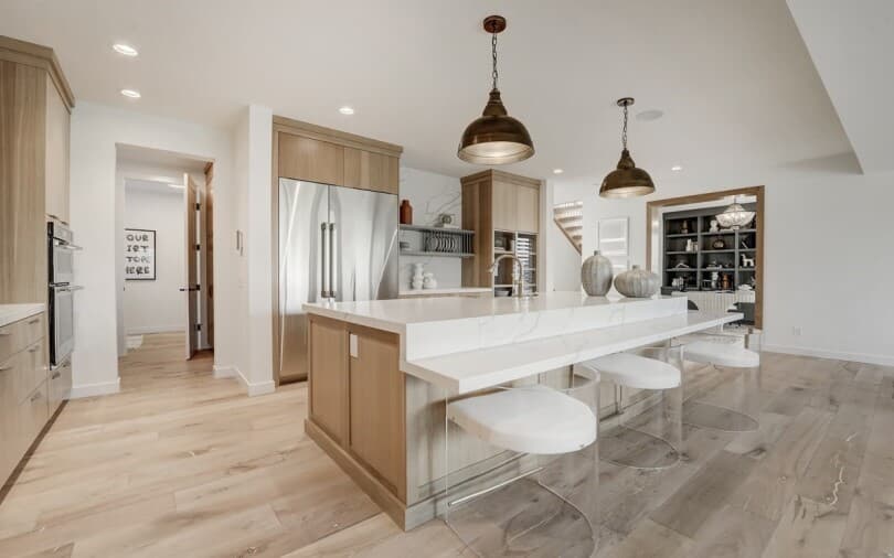 Bright white kitchen in Lucca at Cranstons Riverstone in Calgary AB