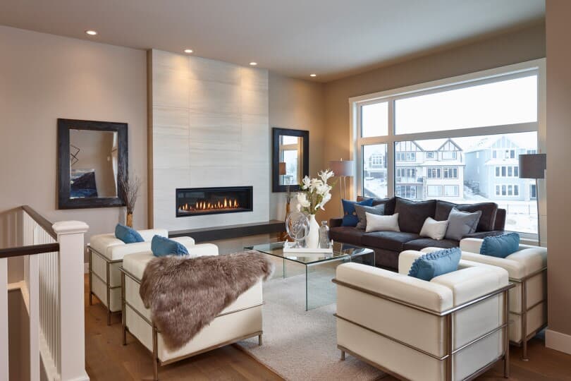 Seating area in the living room of Carmini 3 at Cranstons Riverstone by Brookfield Residential in Calgary