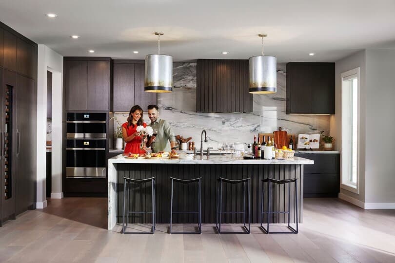 How To Choose The Right Home Builder Brookfield Residential   Couple In The Palermo Kitchen By Brookfield Residential In Calgary Ab 