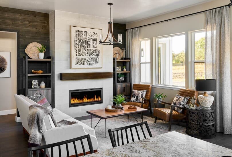 Living room with fireplace and cozy seating at The Village at Castle Pines in Denver CO