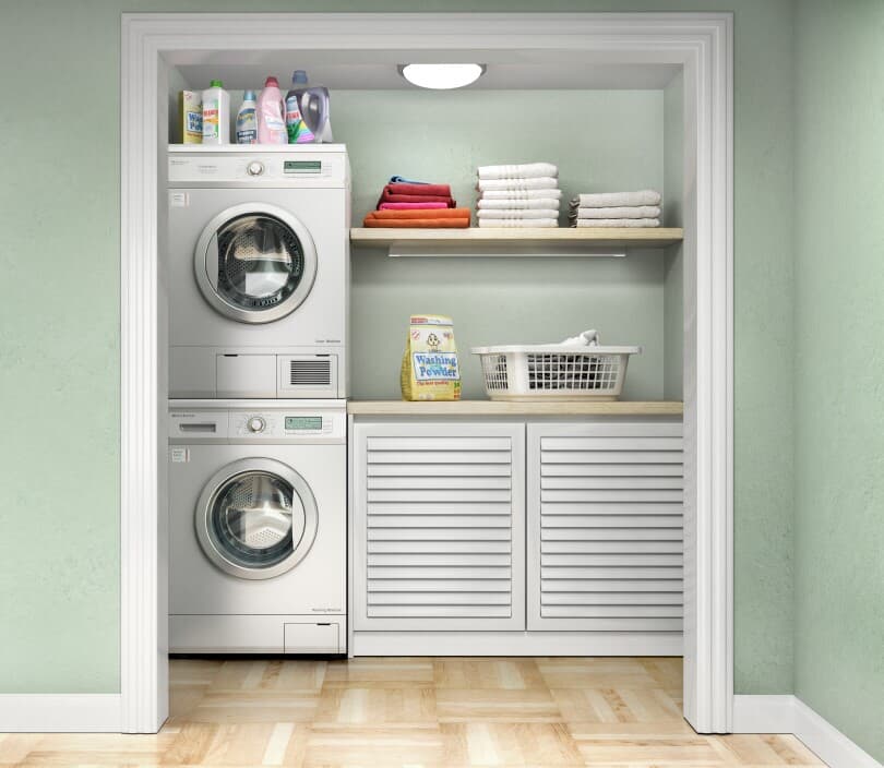 Laundry room set up in a closet space