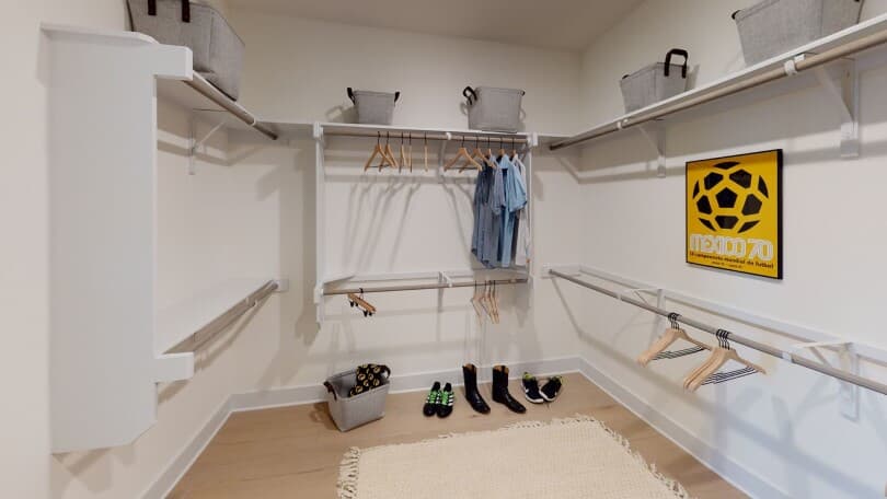 Walk in closet in the Claremont model home at Addison by Brookfield Residential in Austin TX
