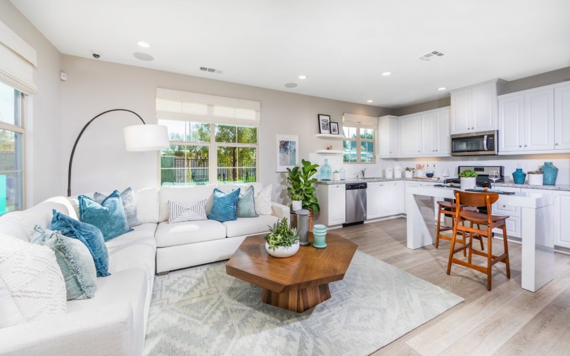 Living room and kitchen in Plan 1 Towns at Lantana at Beach in Stanton, CA by Brookfield Residential