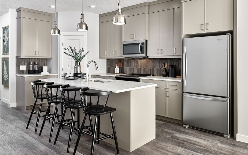 Tan kitchen in the Carlisle 2 showhome by Brookfield Residential in Calgary, AB