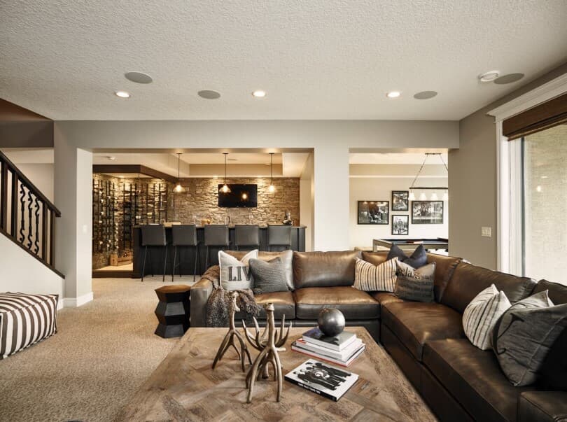 Basement living area in Carrara 2 at Cranston Riverstone by Brookfield Residential in Calgary, AB