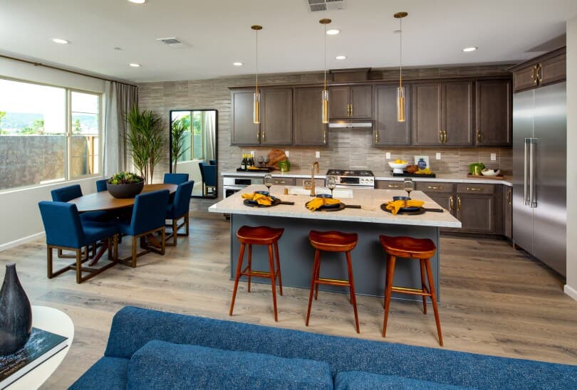 Kitchen and dining area in Melrose Residence 1X at BLVD by Brookfield Residential in Dublin CA