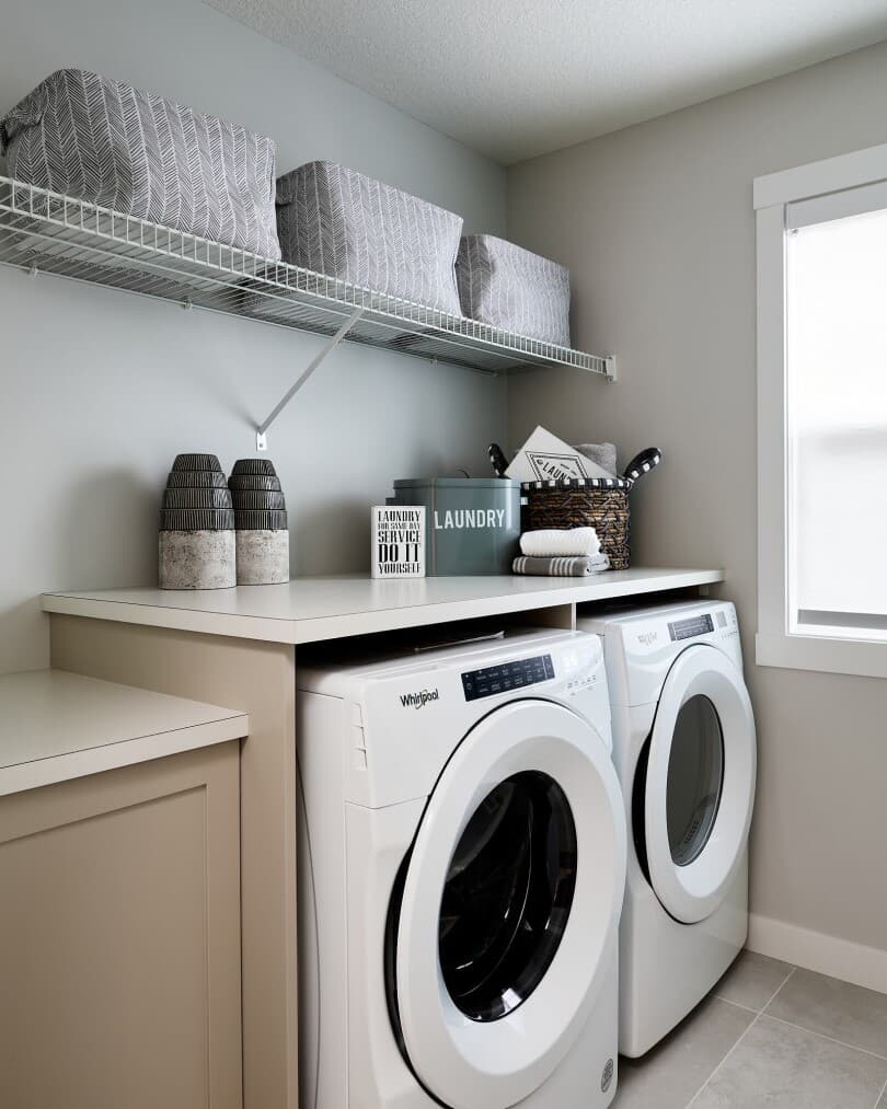 Laundry room in Purcell 24 at Livingston by Brookfield Residential in Calgary