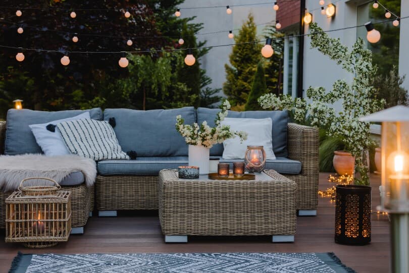 Outdoor living area with lanterns and string lights