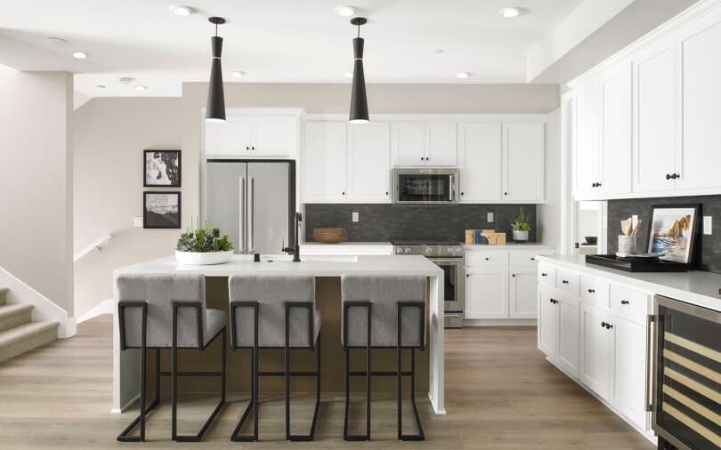 Modern black and white kitchen in the Residence 4 at Broadway at Boulevard in Dublin, CA