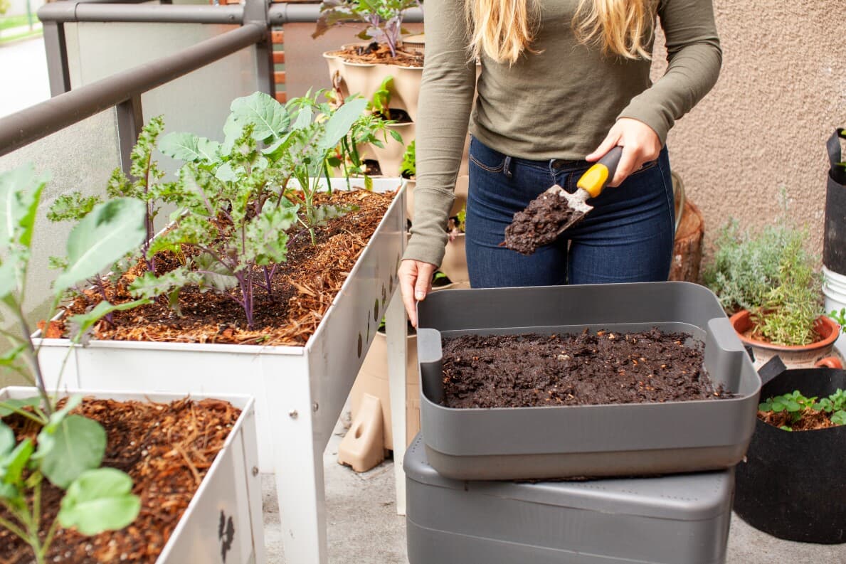 Woman gardening on her small patio space