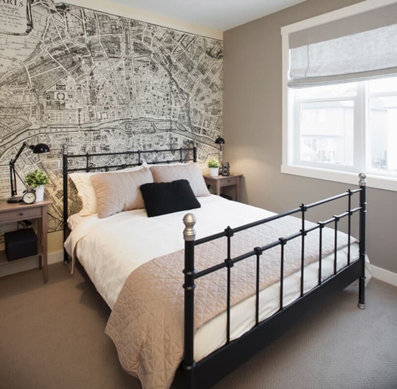 Bedroom with wallpaper in Slate at Cranston Riverstone by Brookfield Residential in Calgary AB