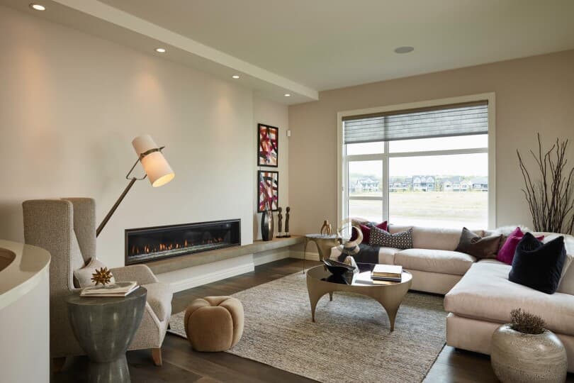 Minimalist great room in Carmini 2 at Cranston Riverstone by Brookfield Residential in Calgary AB