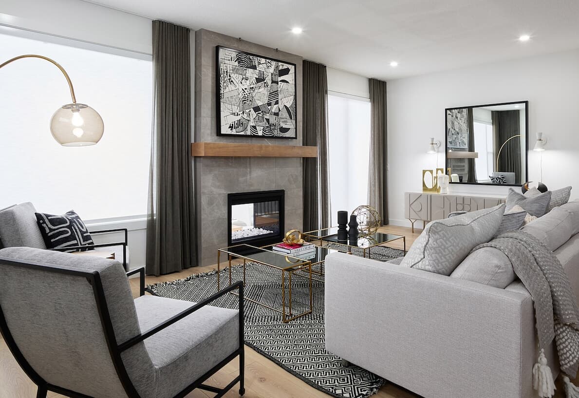 Modern living room in the front garage homes at Livingston Community by Brookfield Residential in Calgary, Alberta