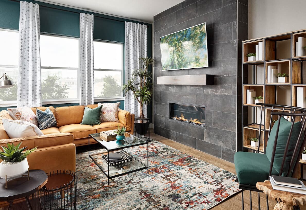 Living Room with slate tile fireplace in Cadence XL Home by Brookfield Residential in Denver, Colorado