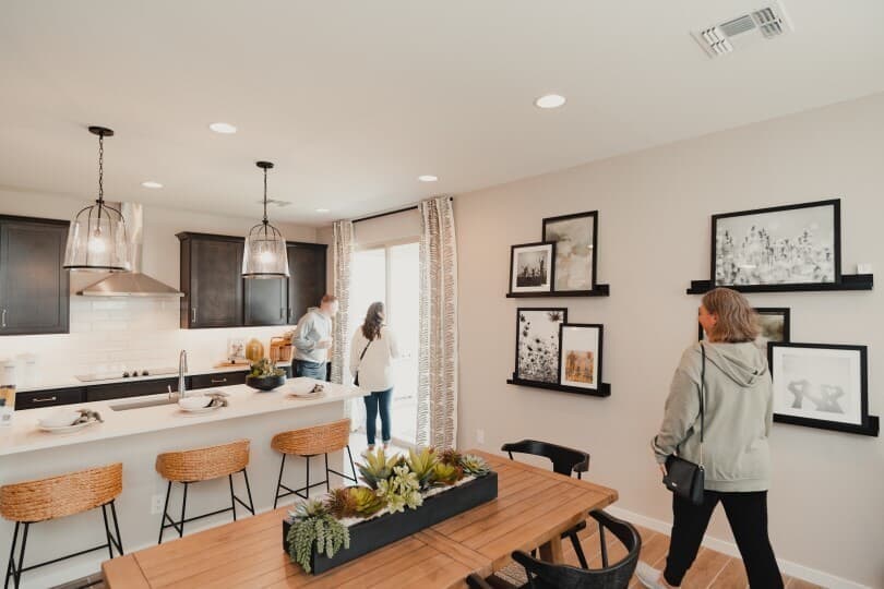 People touring Dakota model home at Highland Sage by Brookfield Residential in Avondale AZ