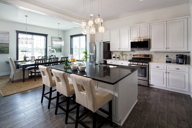 Interior view of the kitchen and dining area in Savoy II at Heritage Shores in Bridgeville, DE