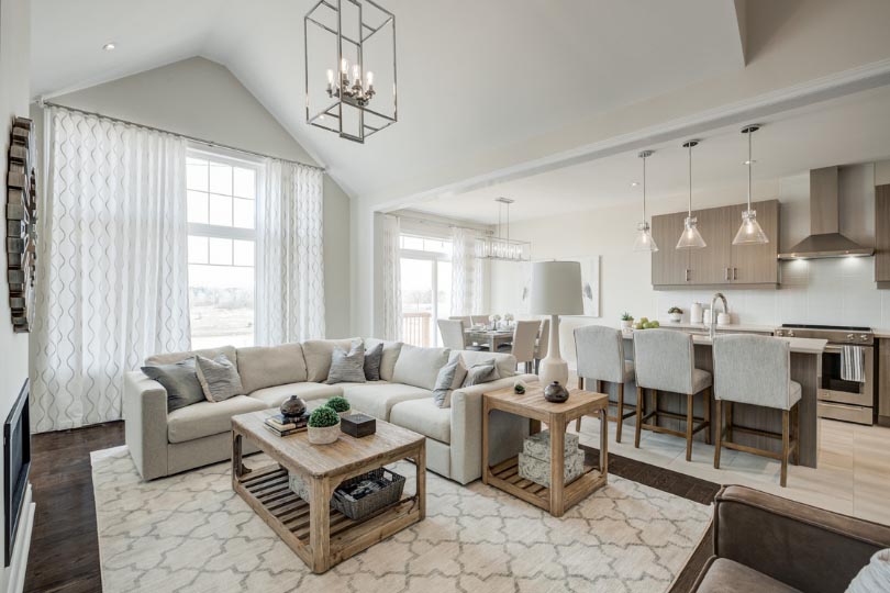 Open-concept family room and kitchen in a Pathways model home.