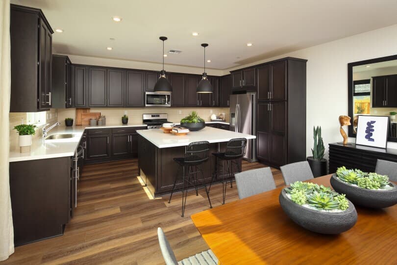 Dark wood tone kitchen in Residence 6 at Chandler in Brentwood, CA