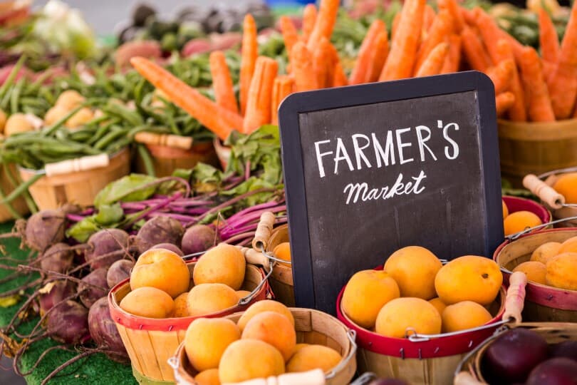 Famers market sign in vibrant produce