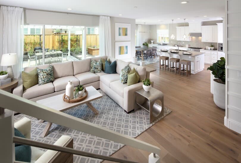 Family Room looking into kitchen and outdoor patio in a home in Northern California by Brookfield Residential