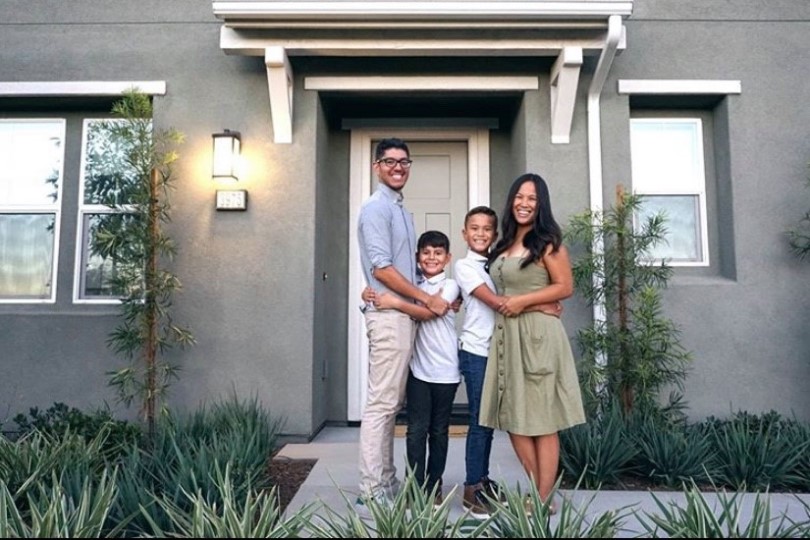 Happy family in front of their new Brookfield Residential SoCal home