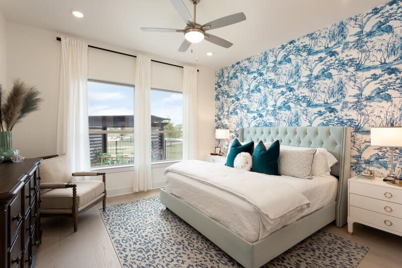Blue tone primary bedroom in the Claremont at Easton Park by Brookfield Residential in Austin, TX